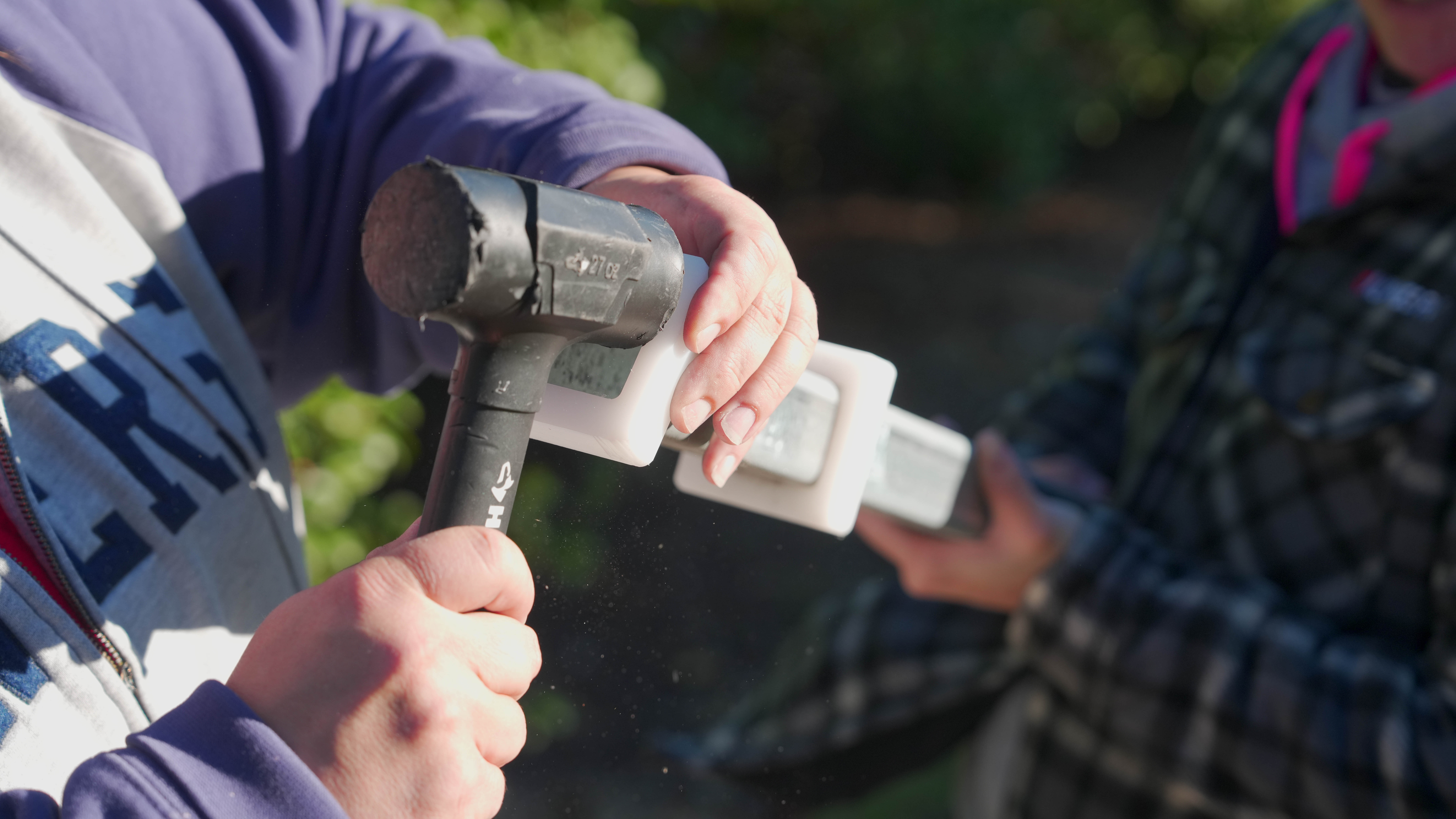 Post-stiffener being driven into position for a snug internal fit