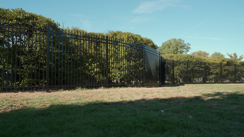 Completed section demonstrating C-POST compatibility with ornamental aluminum fencing